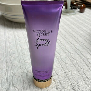 NWOT Victoria Secret Love Spell Body Lotion. 8oz. Purple tube cherry/peach smell
